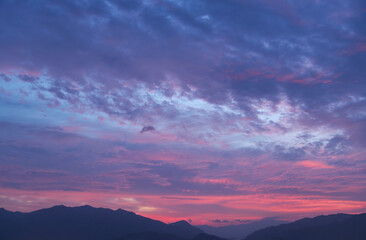 Beautiful bright sunset sky with colorful clouds. Sky background.