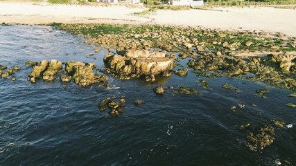 Oceanfront town with rocky and sandy shores
