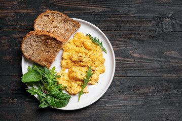 Scrambled eggs with greens for breakfast