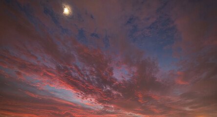 Beautiful bright sunset sky with colorful clouds. Sky background.
