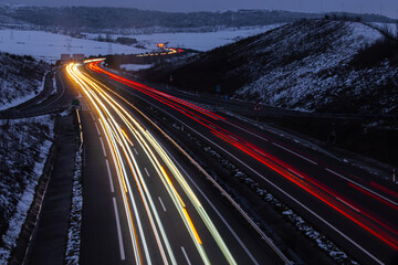 traffic on highway at night, Long exposure of winter landscape from the highway near Cizur in Navarra 