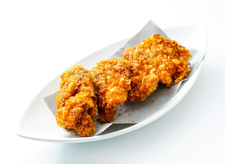 Golden fried chicken tenders look mouthwatering on a white plate. Ideal for food blogs, recipe promotions, and restaurant marketing campaigns.