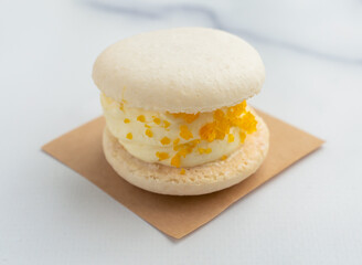 Savor the delightful taste of a lemon macaron, a perfect sweet treat for any occasion. Its creamy filling and vibrant color make it truly irresistible.