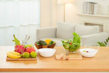 Fresh Fruits and Salad Preparation in a Bright Kitchen During the Day for Healthy Eating
