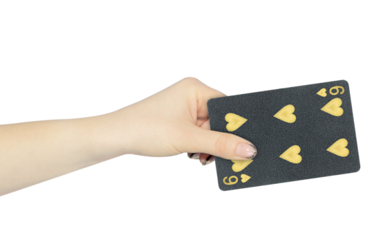 playing card hearts 6 in hand, outstretched hand with black playing card isolated from background