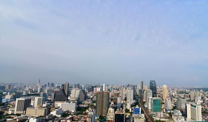 Fototapeta premium Modern Urban Cityscape with Tall Skyscrapers Under a Clear Daytime Sky
