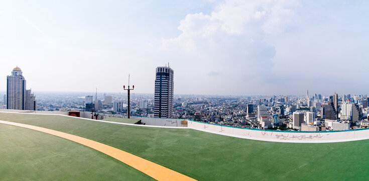 Panoramic View of a Vibrant Cityscape from a Rooftop Perspective