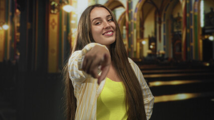 Woman points finger at camera inside church building near pews wearing yellow top; confidence empowerment challenge.
