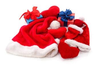 Christmas gifts and red heart decorations with Santa hat on white background.