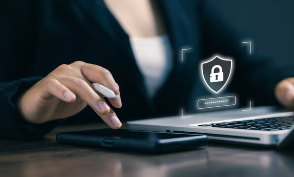 A user authenticating secure access on a laptop with a digital lock icon, symbolizing cybersecurity, privacy protection, encryption, identity verification, and modern secure technology solutions.