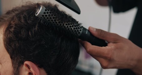 Hands, brush and hairdryer at barbershop, customer and tools for treatment, closeup or grooming services, People, appliance and equipment for hairdresser, style or appointment for makeover at salon