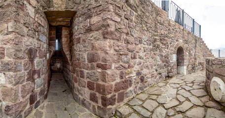 Panoramic view of Ankara Castle's fortress walls with stone masonry and defensive embrasures. A historical landmark spanning Hittite, Roman and Seljuk civilizations. Ankara, Turkey.

