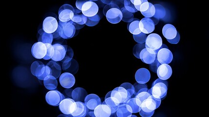 Shiny blue bokeh circles on dark black background abstract wallpaper with soft glowing light effects for digital design, desktop backgrounds, and creative projects