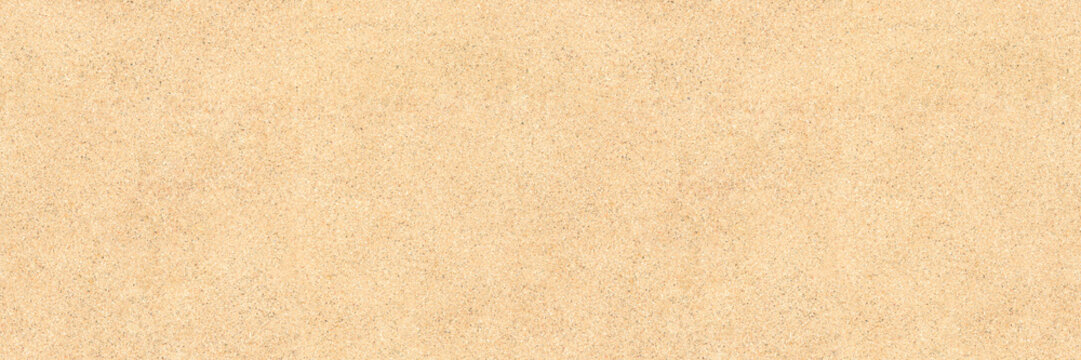 Beach sand background texture &ndash; top view of seamless flat sand surface. Brightly lit and sunny. Image is ready to be tiled to create a much larger image or higher resolution background.