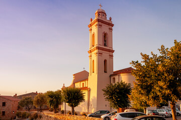 Fototapeta premium Baroque style Santa Maria Assunta church ( l792), stands majestically in the heart of the village. Piana, Corsica island, France. 