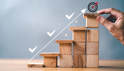 Hand placing final wooden block on ascending staircase with arrow, checkmarks, and target icon on neutral background.