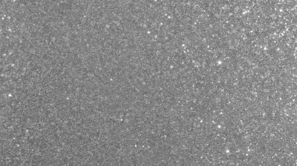 A dazzling silver glitter texture creates a shimmering and festive backdrop, perfect for adding a touch of glamour