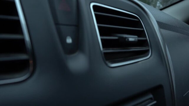 Close-Up Interior View of Car Air Vent with Buttons and Control Panel, Highlighting Modern Design and Functionality in Automotive Spaces. Video with sound