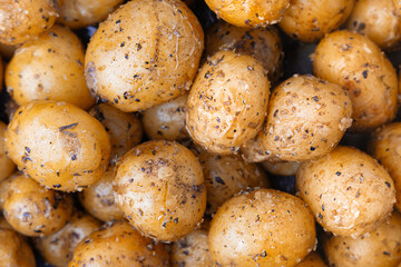 background of baked fresh potatoes in spices