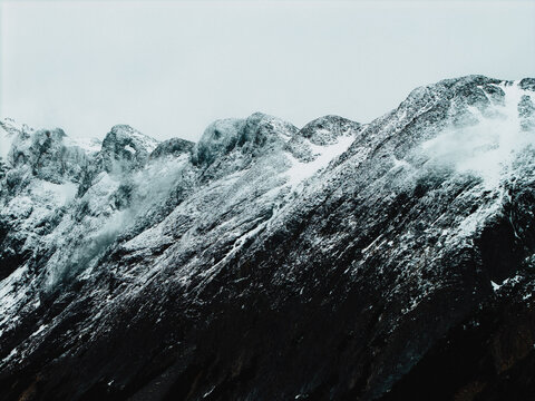 Laguna Esmeralda surrounded by mountains in Ushuaia, Argentina in Tierra del Fuego by drone