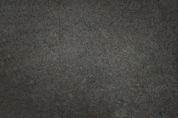 background of dark grainy road asphalt