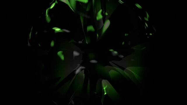 A lustrous green gemstone gleams against a black backdrop, likely symbolizing opulence or as an ornamental piece for aesthetic appeal
