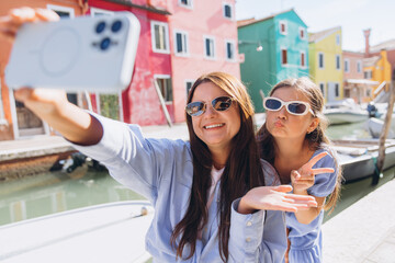 Mother daughter selfie traveling in Burano Italy
