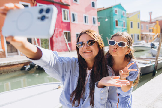 Mother daughter selfie traveling in Burano Italy - Powered by Adobe