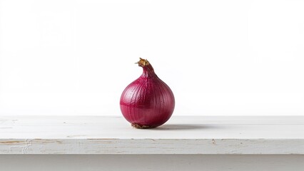 Red onion on a white surface with a plain white background. Fresh vegetables and culinary ingredients. The concept of cooking and healthy eating.