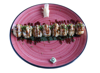 Sushi rolls with sauce, wasabi, and ginger on a red plate, ready to eat
