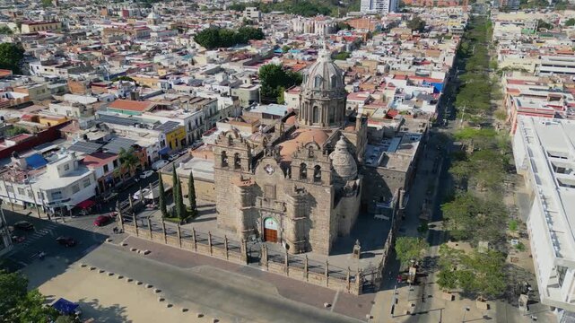 Drone aerial orbit anticlockwise movement around Shrine of Our Lady of Guadalupe in downtown Guadalajara Jalisco Mexico