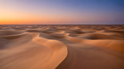 Endless desert landscape with sand dunes under colorful sunset sky panoramic nature scenery of arid environment travel destination and outdoor adventure