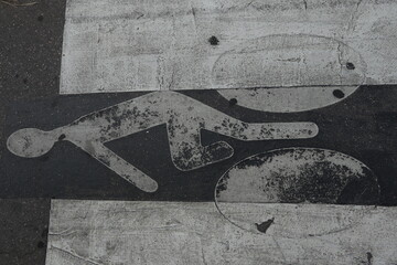 White bicycle sign paint on tarmac