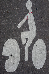 White bicycle sign paint on tarmac