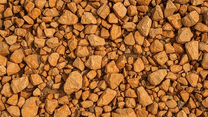 A pile of small to medium-sized rocks with a reddish-brown color.