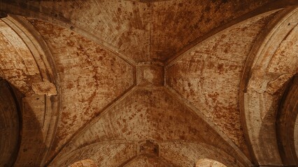 Interior view of ancient brick vaulted ceilings showcasing historic architecture and engineering.