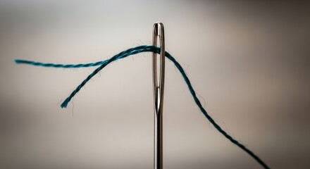 Elegant needle with blue thread, an artistic macro photography detail