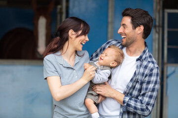 Obraz premium happy young family going for a walk in forest