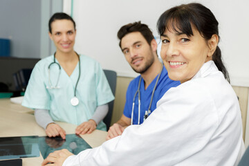 doctor and surgeons looking at xray film