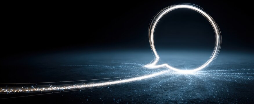 Futuristic digital communication concept with glowing chat bubble and dynamic light streaks