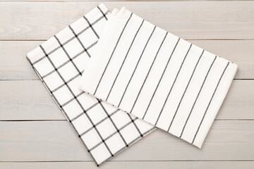 Kitchen napkin on wooden background, top view