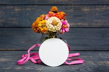 A bouquet of flowers on a wooden background, banner, flyer. Floral poster card frame typography design photo. Template for advertising, social media, web with space for text