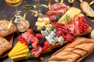 Party charcuterie board italian food antipasti prosciutto ham, salami and cheese appetizers served...