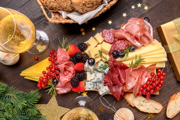 Party charcuterie board italian food antipasti prosciutto ham, salami and cheese appetizers served...