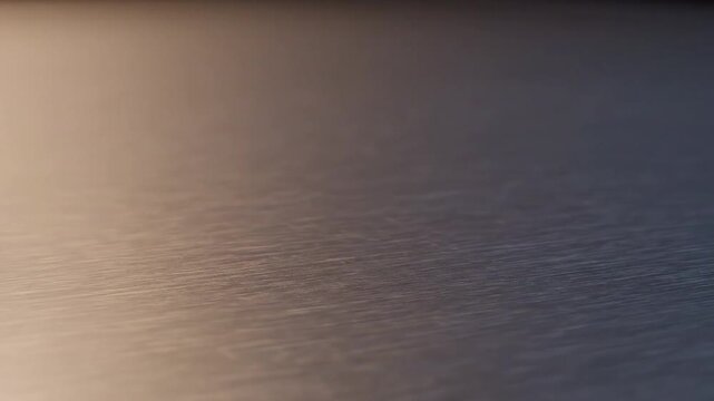 Close-up of a metallic corner joint with bolts on a textured surface, showcasing precision engineering