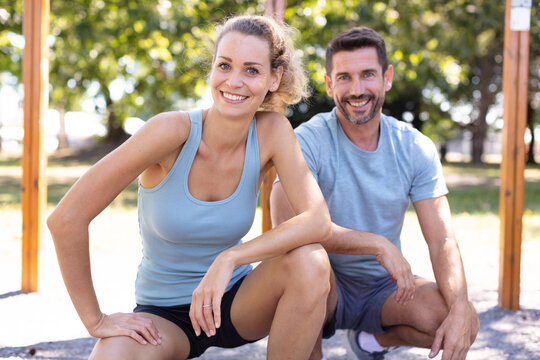 couple stretching after doing exercises