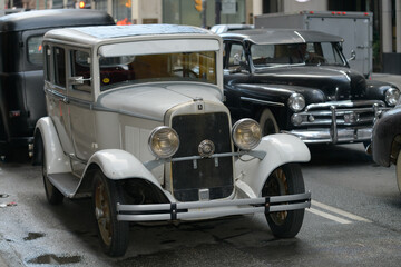 Fototapeta premium vintage automobiles on a film set along Bay St, Toronto