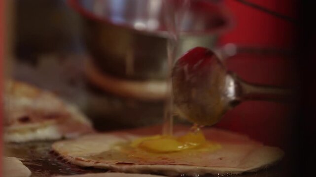 closeup shot of Cooking egg roll on big pan.