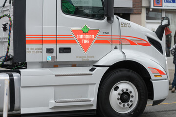 Fototapeta premium detail of a tractor unit featuring Canadian Tire logo at The Original Santa Claus Parade, Toronto