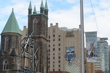Fototapeta premium Cielo Residences, condo development by Collecdev-Markee, incorporating former Bloor St United Church, 300 Bloor St W, Toronto (Kimpton Saint George hotel, mural by Jerry Rugg)